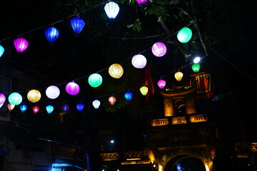 Fototapeta na wymiar City of Hanoi, Lights of Lantern around Street Murals Arts in Hanoi, Vietnam - ベトナム ハノイ ランタンの明かり