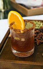 Wassail with spices or mulled cider with Cha&iuml; spices in a vintage glass