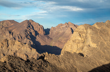 Panorama from trail to Toubkal, ridges and highest peaks of High Atlas mountain in Morocco on sunrise