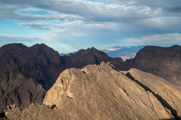 Panorama from trail to Toubkal, ridges and highest peaks of High Atlas mountain in Morocco on sunrise