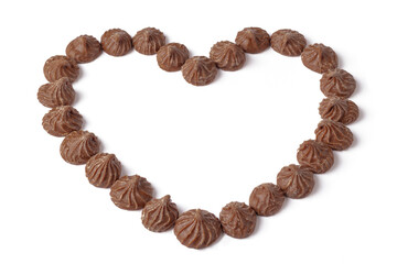 Delicious chocolate rosebud candy heart shape on white.