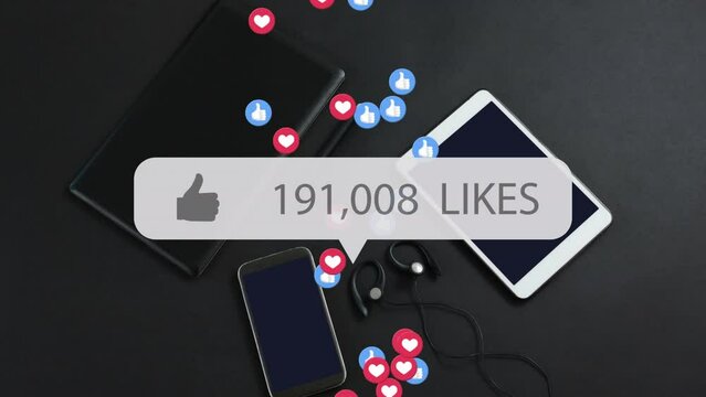 Animation of likes growing number with icons over smartphone and tablets on black background