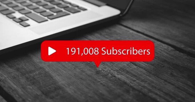 Animation of subscribers growing number over laptop on desk