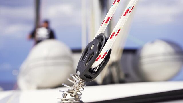 Close-up of a yacht block with colorful ropes on the deck. Sailing. Sports yacht. 4K.