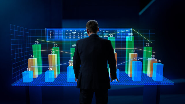 Business Metaverse and Virtual Space Concept: Businessman Operating Augmented Reality Dashboard in Cyberspace. Specialist Touching the Hologram to Show Interactive Charts and Graphs with Statistics