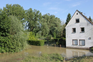 Fototapeta na wymiar A house on the flooded bank of Rhine river 