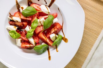 tomato salad with mozzarella, basil and balsamic cream