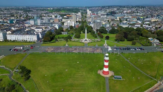 Ascending drone footage of the Hoe Park and the cityscape of the coastal city of Plymouth, England
