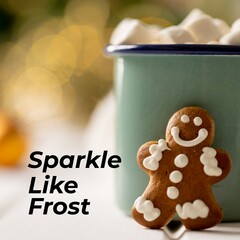 Composite of sparkle like frost text over gingerbread man and cup of hot chocolate