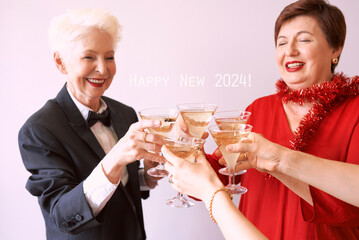 new year celebrating hands with glasses of white sparkling wine. Christmas, family, friends, celebrating, new year concept