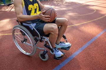 Basketball player man in wheelchair with a disability on court.