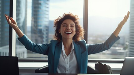 Successful businesswoman raises her hands up rejoices in increasing profits in business. Businesswoman is receiving good news online, raising her hands and showing her fists.