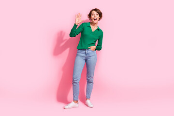 Full body length photo of friendly young lady waving palm combinated to jeans welcome you in store...