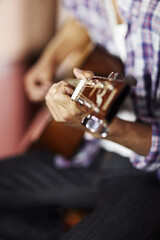 Guitar, hands or man in home for music, performance or entertainment with sound, rhythm or talent. Learning solo, artist closeup or creative musician playing an instrument for artistic expression