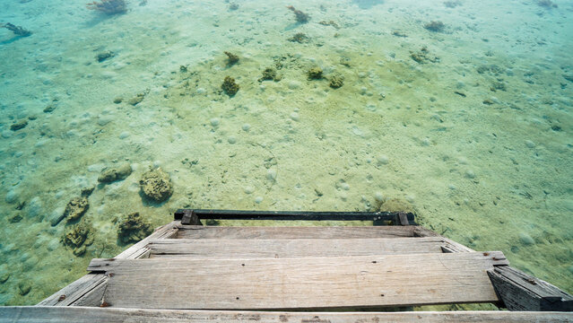 Capturing the Serenity of a Pristine Beach Dock, Pulau Macan, Jakarta, Indonesia