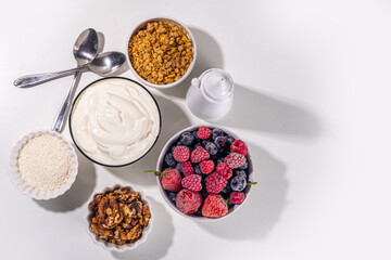 Cooking making Frozen Yogurt Bark background with greek yogurt, fresh berry, granola, honey,...