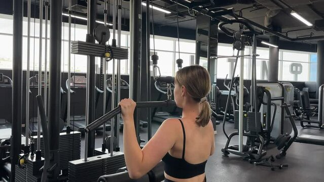 Gym.Fitness woman working out in the gym, doing exercises for health and beautiful figure..fitness in gym,fitness girl,fitness,fitness,mental health,active lifestyle,self-care,health,wellness,fitness