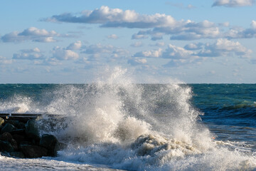 Storm waves crash against the shore