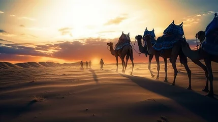 Fotobehang Camel caravan in the desert of Sahara at sunset © IRStone