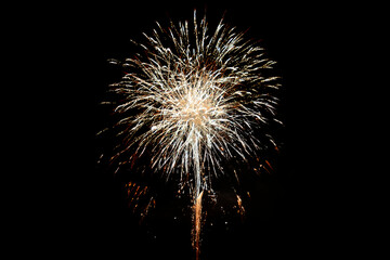 Fireworks. Colorful celebration fireworks isolated on a black sky background. From below, shot of...