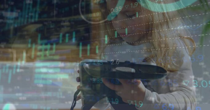 Animation of multiple graphs and trading board, caucasian girl holding and looking at vr headset