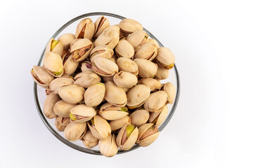 Pistachios in a glass bowl.