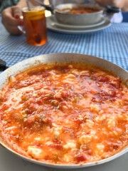 scrambled eggs known as menemen in Turkish over tea on table