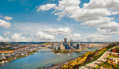 Panoramic aerial view of downtown Pittsburgh, Pennsylvania at the intersection of three rivers, the Allegheny, the Monongahela, and the Ohio, taken from atop Mount Washington