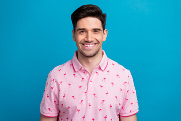 Portrait of cheerful satisfied nice person beaming smile good mood wear polo shirt isolated on blue color background