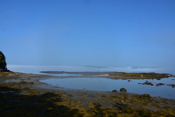 Layering Of Fog Over the Tranquil Ocean Waters