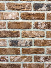 brown brick wall with detailed grooves