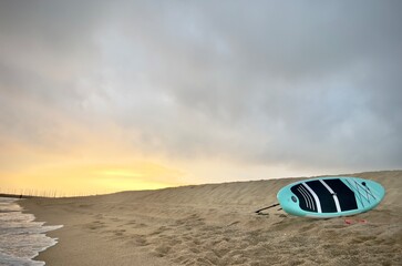 Paddleboard on the beach of premia de mar, spain - obrazy, fototapety, plakaty