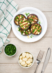 halves grilled aubergine, with chilli pepper and spices, top view. Ideas for barbecues and grill parties.