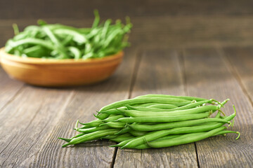 fresh green beans on a wooden table, selective focus.