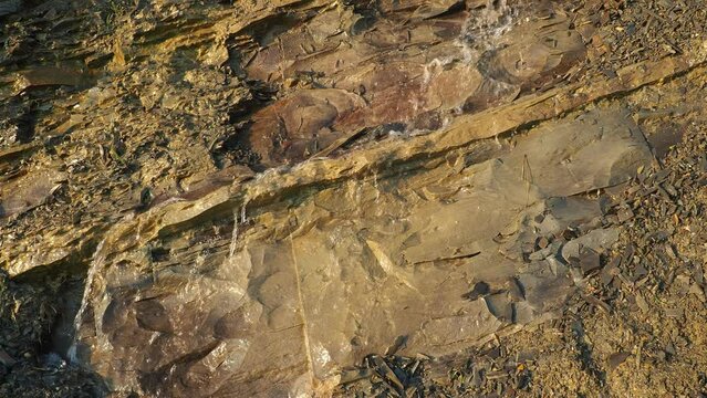 Flysch is a series of marine sedimentary rocks that are predominantly clastic in origin. Alternation of lithological layers. A stream of water or sewage running down a rock. Caucasus Mountains
