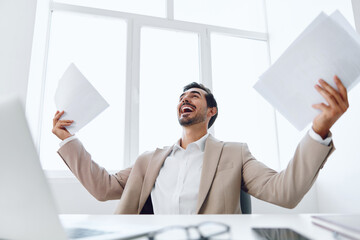 Paper company laptop suit office employee holding document male planning happy businessman