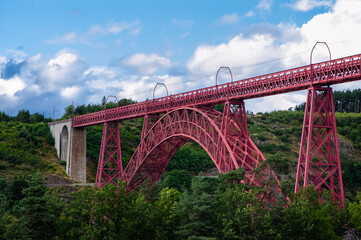 Garabit Viaduct, a red railway arch bridge constructed by Gustave Eiffel. Cantal, France