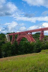 Garabit Viaduct, a red railway arch bridge constructed by Gustave Eiffel. Cantal, France