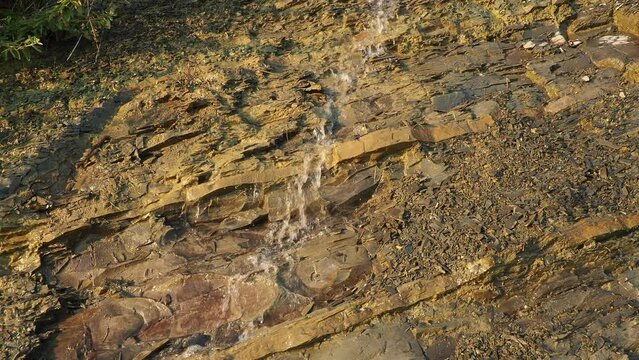 Flysch is a series of marine sedimentary rocks that are predominantly clastic in origin. Alternation of lithological layers. A stream of water or sewage running down a rock. Caucasus Mountains
