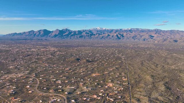 Panoramic view of Sonoran Desert landscape including Mt Lemmon in Santa Catalina Mountains and Rincon Mountains in Saguaro National Park east in city of Tucson, Arizona AZ, USA.
