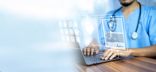 Doctor using computer in office.