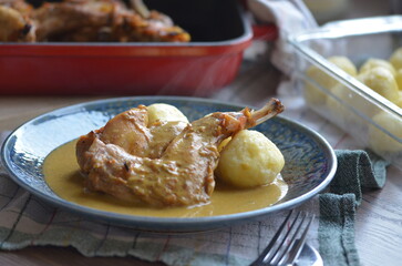 close up, rabbit leg on cream sauce, Czech cuisine, dumpling