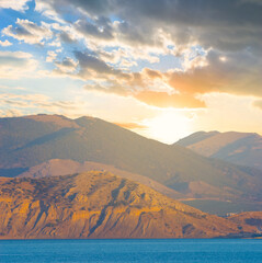rocky sea coast at the bright sunset