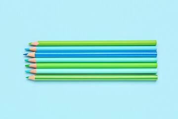 Set of bright pencils on color background