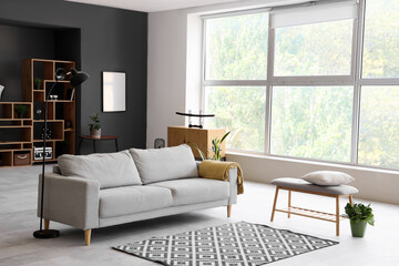 Interior of modern living room with soft bench and sofa