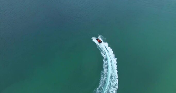Aerial view, speedboat and ocean or sea with waves for travel, vacation or holiday with peaceful background. Drone, beach and lake or water with boat or transportation for adventure in Cape Town