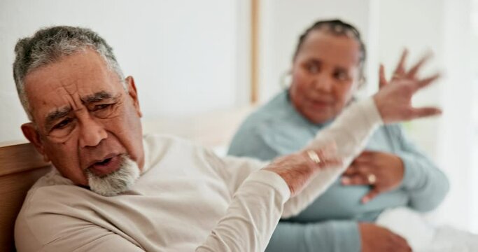 Divorce, bed and senior couple arguing with marriage problems or relationship conflict while fighting. Stress, mental health or breakup and an elderly husband angry with his wife in the home bedroom