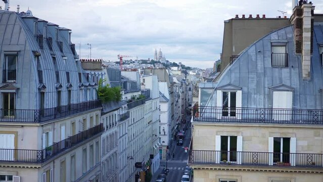 Parisian apartments, Montmartre hilltop, popular tourism attraction in Paris. Famous travel landmark in France. European city, honeymoon destination. 