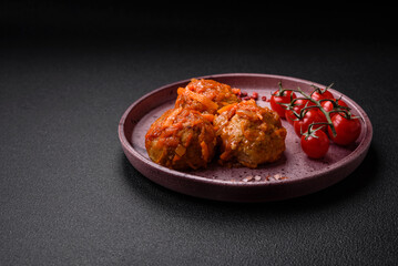 Delicious fresh meatballs from minced meat or fish with tomato sauce