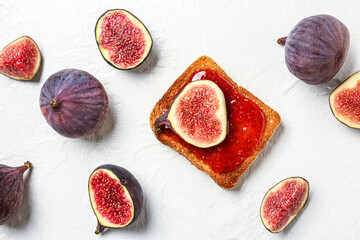 Toast with sweet fig jam on white background
